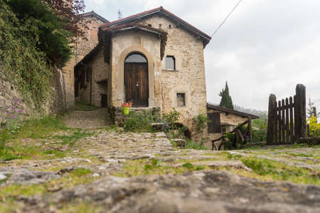 Borgo la Scola, Italy-April 2, 2017: Strolling through Borgo La Scola, one of the best preserved medieval villages of the Bolognese Apennines during a cloudy dayのeditorial素材