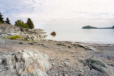 Strolling in the National Parc du Bic between the sea and beautiful landscapes during a summer dayの写真素材
