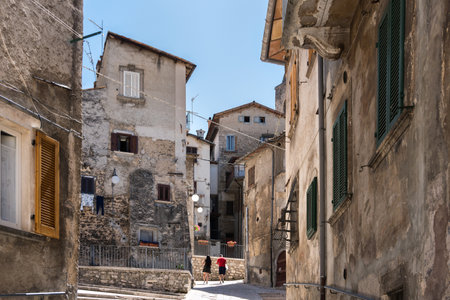 Scanno, Italy-august 8, 2021: people strolling through the narrow streets of Scanno, one of the many ancient villages of Italy during a summer dayのeditorial素材