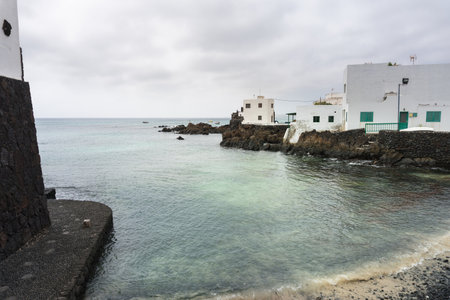 Lanzarote, Spain - August 7,2018: view of the small town of Punta Mujeres on the island of Lanzarote famous for its natural swimming pools during a cloudy dayのeditorial素材