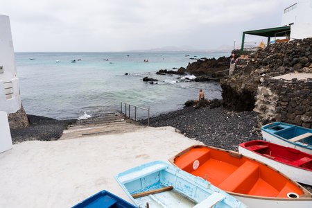 Lanzarote, Spain - August 7,2018: view of the small town of Punta Mujeres on the island of Lanzarote famous for its natural swimming pools during a cloudy dayのeditorial素材