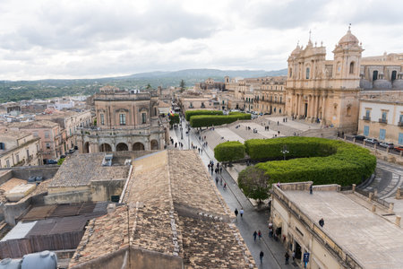 Noto, Italy-May 7, 2022: View of the beautiful Cathedral of Noto from the terrace of the church of Santa Chiara during a sunny dayのeditorial素材