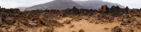 classic panorama of the volcanoes of the island of Lanzarote during a cloudy day