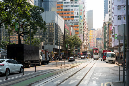 Hong Kong, March 25,2019: Strolling among the skyscrapers through the streets of Hong Kong during a cloudy dayのeditorial素材