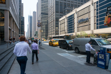 New York City, USA - August 8, 2019:people strolling among the skyscrapers in Manhattan during a sunny dayのeditorial素材