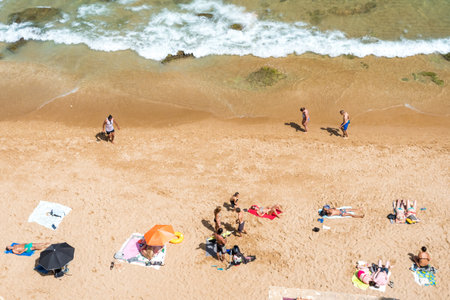Algarve,Portugal-august 15, 2017:people on the beach in the Algarve coast in Portugal during a sunny...