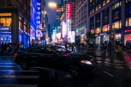 New York City, USA - August 9, 2019:People and tourists stroll among the lights and skyscrapers of Time Square in Manhattan during a summer nightのeditorial素材