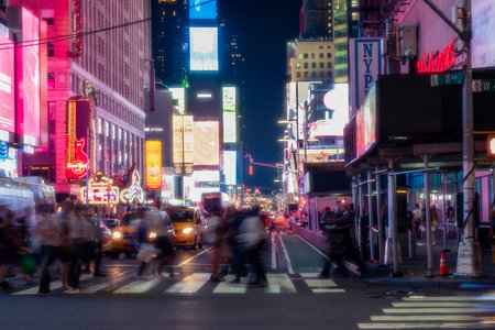 New York City, USA - August 9, 2019:People and tourists stroll among the lights and skyscrapers of Time Square in Manhattan during a summer nightのeditorial素材