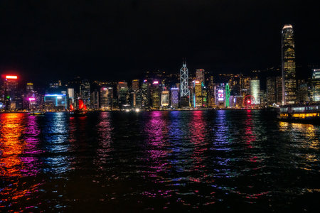Hong Kong,March 25,2019:View of the skyscrapers on the famous Victoria harbor as they put on a light show at nightのeditorial素材