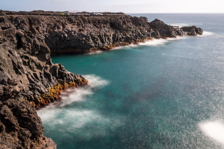 View of a stretch of coast of Lanzarote called Los Hervideros during a sunny dayの写真素材
