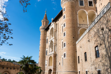 Urbino, Italy-april 27, 2019:walking through the ancient streets near the Ducal Palace of Urbino during a sunny dayのeditorial素材