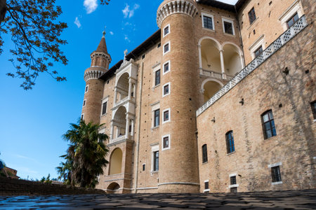 Urbino, Italy-april 27, 2019:walking through the ancient streets near the Ducal Palace of Urbino during a sunny dayのeditorial素材