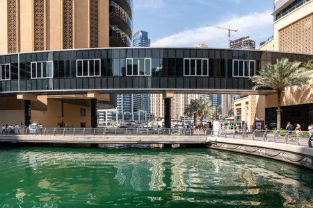 Dubai, United Arab Emirates - March 12, 2023:View of Dubai skyscrapers while walking at Dubai Marina during a sunny dayのeditorial素材