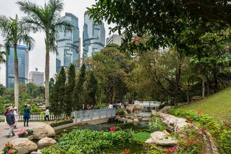 Hong Kong,March 26,2019:Interior of Hong Kong park, a city park surrounded by skyscrapers during a...