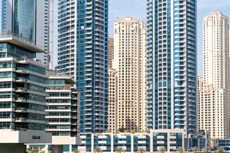 Dubai, United Arab Emirates - March 12, 2023:View of Dubai skyscrapers while walking at Dubai Marina during a sunny dayのeditorial素材
