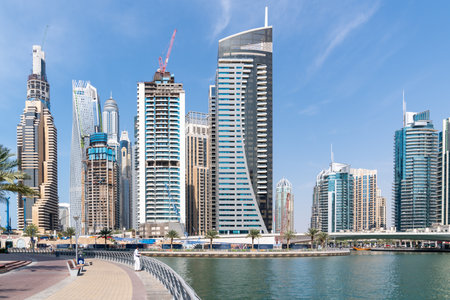 Dubai, United Arab Emirates - March 12, 2023:View of Dubai skyscrapers while walking at Dubai Marina during a sunny dayのeditorial素材