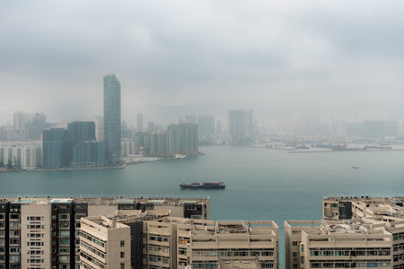 Hong Kong,March 26,2019:Panorama of skyscrapers of hong kong bay during a hazy dayのeditorial素材