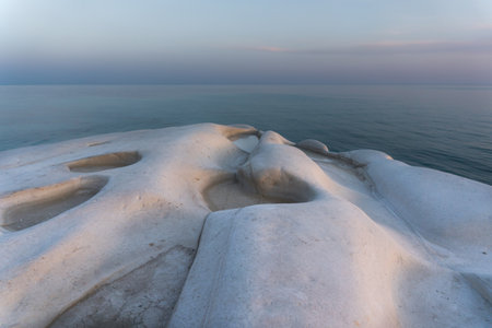 Sunset overlooking the Scala dei Turchi in Sicily during a summer eveningの写真素材