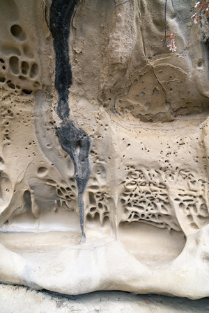 Vertical photograph that showing the peculiar formations of the Soprasasso caves in Emilia on a cloudy dayの写真素材