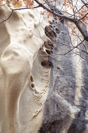 curious rock formations of the Soprassasso caves on a cloudy dayの写真素材