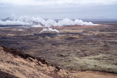 Reykjanes peninsula, Iceland-March 17, 2025:Gunnuhver Hot Springs seen from the hill of the Reykjanes Lighthouse on a cloudy dayの写真素材
