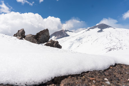 snow on Mount Etna in Sicily on a sunny dayの写真素材
