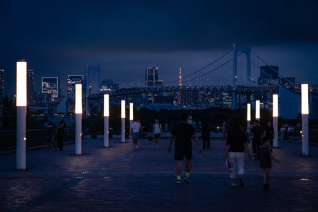 Tokyo, Japan-August 6, 2024:people on the observation deck at Odaiba Seaside Park during the nightのeditorial素材