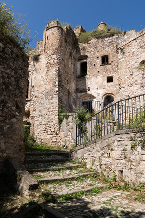 Craco, Italy-April 25, 2025:vertical photograph of staircase with a railing leads up to Craco on a sunny dayのeditorial素材