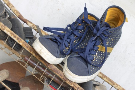 White soled blue canvas shoes with polka dot motiveの写真素材