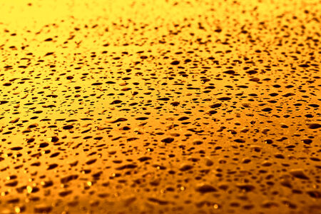 Water droplets on the flat glass surfaceの写真素材