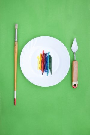 oil paint served like a dish with painting instrumentsの写真素材