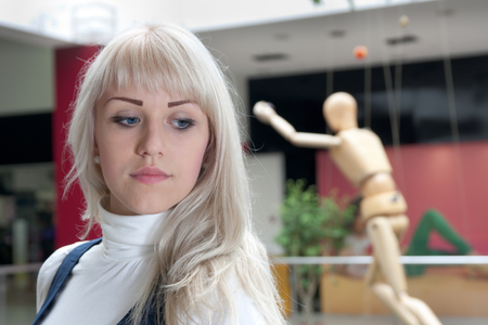 young woman thinking about something romantic in a contemporary art museumの写真素材