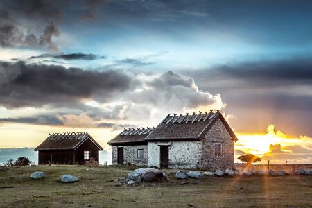 Sunrise behind the clouds, Ottenby, land, Sweden. Ottenby is the far south of the island and it's famous for bird watching, sunrise and sunset regardless of the season.の写真素材
