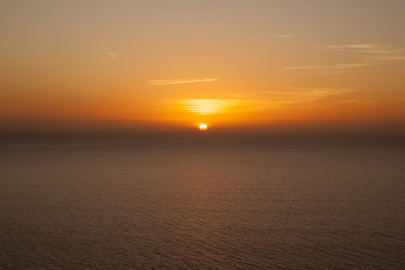 Sunset over North Atlantic Ocean with slight Omega phenomenon at Puerto Rico, Gran Canary Island, Spain.の写真素材