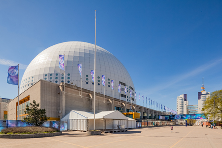 Stockholm, Sweden - May 6 : External view of the Stockholm Globe Arena with the official Eurovision flags flapping in winds. The Grand finale will be held in the Globe on May 14 at here.のeditorial素材