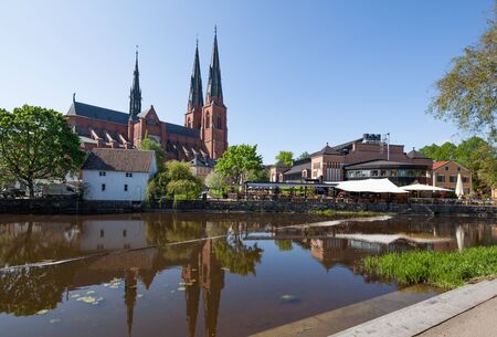 Uppsala, Sweden - May 20, 2016 : Uppsala Church with its reflection on the river.のeditorial素材