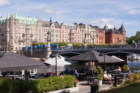 Stockholm, Sweden - Jul 27, 2016 : View of Stockholm djurgarden bridge, waterfront park and cafe in summer.のeditorial素材