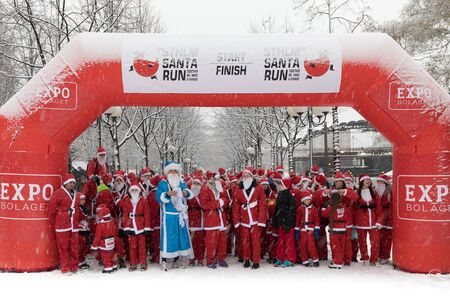 Stockholm, Sweden - Dec 11, 2016 : Stockholm Santa Run, a non competitive charity run for everyone, 2016 at Kungstradgarden Park, Stockholm, Sweden.のeditorial素材