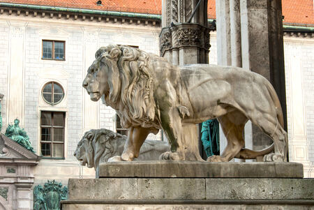 Statues of Lions on a Memorial in Munich, Germany.の写真素材