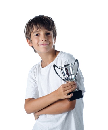 champion child holding winner cup 2 isolated on whiteの写真素材