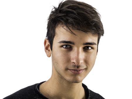 Close-up of handsome young man or teenager in studio, isolated on white background
