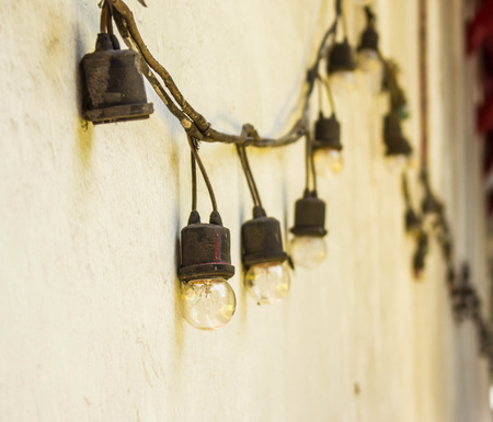 Old lamp hanging on the wall.の写真素材