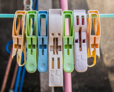 Clamps clothing on a hangers.の写真素材