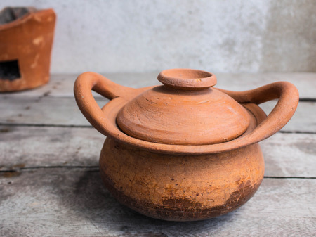 Clay pot for cooking on the tableの写真素材