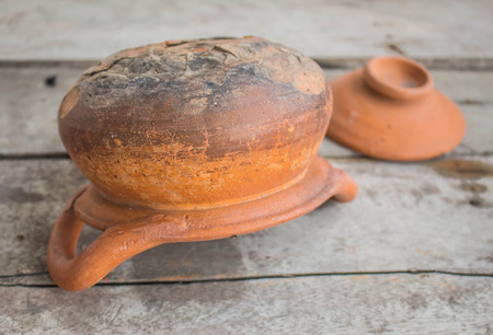 Old clay pots are cracking down and idle.の写真素材