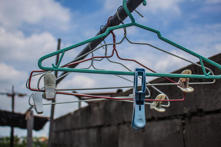 The clothespin And hangers on railの写真素材