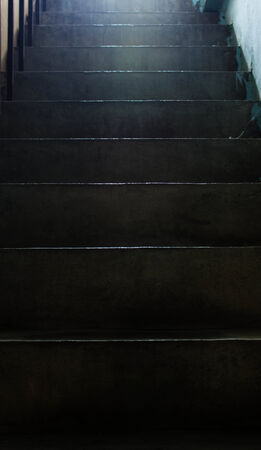 Stairs dark hallways during the day light hours.の写真素材