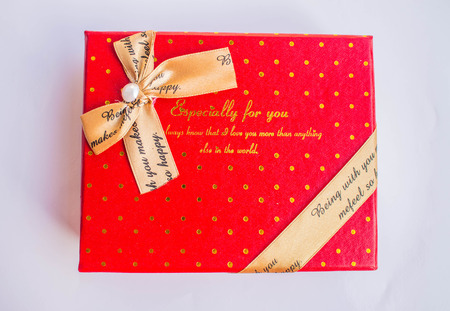 Red gift boxes decorated with bow tie.の写真素材