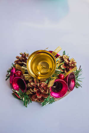 Bell and golden decoration on white background.の写真素材