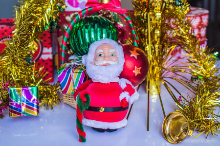 Santa Claus with gifts to bring happiness at Christmasの写真素材